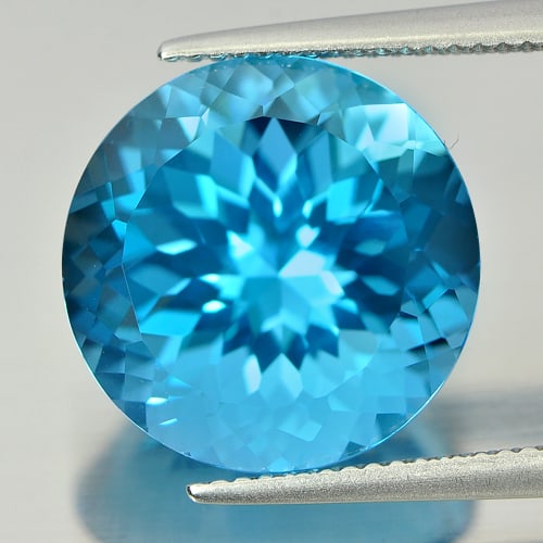 Natural Swiss Blue Topaz 15.17 Ct. Round Cornflower Cut 14.9 Mm Gemstone From Brazil: Product ID: 807166753 Product Name: Natural Blue Topaz Weight: 15.17 CT. Size: 14.9 x 14.9 x 10.4 MM. Shape: Round Cornflower Cut Color: Blue Clarity:IF Luster: Good Gems Origin: Brazil Treatment: Tre