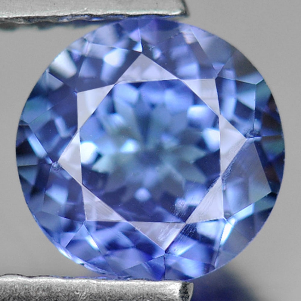 Natural Violetish Blue Tanzanite 1.21 Ct. VVS Round Shape 6.5 Mm. Gemstone From Tanzania: Product ID: 807009523 Product Name: Natural Tanzanite Weight: 1.21 CT. Size: 6.5 x 6.5 x 4.2 MM. Shape: Round Color: Violetish Blue Clarity:VVS Luster: Good Gems Origin: Tanzania Treatment: Heated Cry