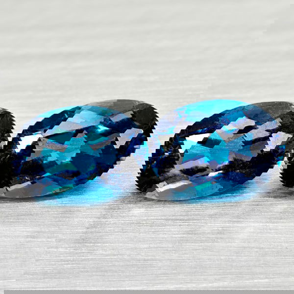 Natural London Blue Topaz 2.06 Ct. 2 Pcs. Oval Shape 7 x 5 Mm. Gemstones From Brazil: Product ID: 807168061 Product Name: Natural Blue Topaz Weight: 2.06 CT. Size: 7 x 5 x 3.7 MM. Shape: Oval Color: London Blue Clarity:VSI Luster: Good Gems Origin: Brazil Treatment: Treated Crystal Str