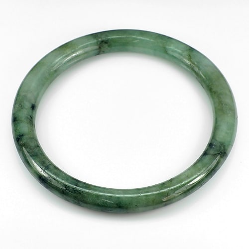Natural Green Jade 165.51 Ct. Round Cabochon Bangle 75 x 59 x 7.5 Mm. Gemstone From Thailand: Product ID: 819812300 Product Name: Natural Jade Weight: 165.51 CT. Size: 75 x 59 x 7.5 MM. Shape: Round Cabochon Color: Green Clarity:Opaque Luster: Good Gems Origin: Thailand Treatment: Unheated Cry