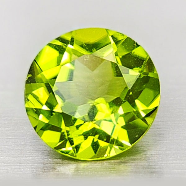 Natural Green Peridot 1.85 Ct. Round Shape 8 Mm Gemstone From Thailand: Product ID: 805316905 Product Name: Natural Peridot Weight: 1.85 CT. Size: 8 x 8 x 4.6 MM. Shape: Round Color: Green Clarity:VSI Luster: Good Gems Origin: Thailand Treatment: Unheated Crystal Structur