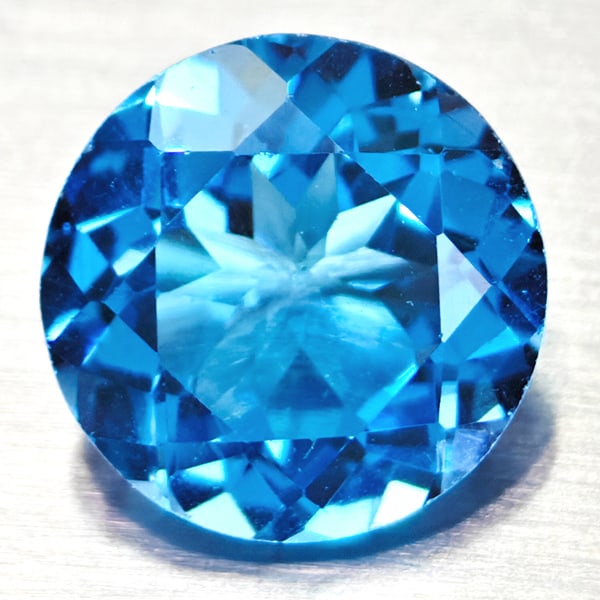 Natural Swiss Blue Topaz 3.14 Ct. VVS Round Shape 9 Mm. Gemstone From Brazil: Product ID: 807167737 Product Name: Natural Blue Topaz Weight: 3.14 CT. Size: 9 x 9 x 5.3 MM. Shape: Round Color: Swiss Blue Clarity:VVS Luster: Good Gems Origin: Barzil Treatment: Treated Crystal Str