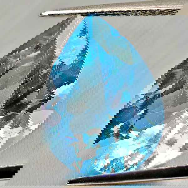 Natural Swiss Blue Topaz 8.91 Ct. Pear Shape 15.9 x 12 Mm Gemstone From Brazil: Product ID: 807167900 Product Name: Natural Blue Topaz Weight: 8.91 CT. Size: 15.9 x 12 x 7.8 MM. Shape: Pear Shape Color: Swiss Blue Clarity:VSI Luster: Good Gems Origin: Brazil Treatment: Treated Cr