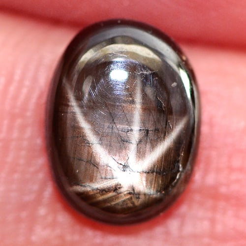 Natural Black Star Sapphire 6 Rays 1.51 Ct. Oval Cabochon Shape 8.2 x 6.2 Mm. Gemstone: Product ID: 806146153 Product Name: Natural Star Sapphire Weight: 1.51 CT. Size: 8.2 x 6.2 x 2.8 MM. Shape: Oval Cabochon Color: Black Clarity:Opaque Luster: Good 6 Rays Star Gems Origin: Thailand Tre