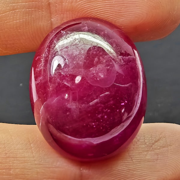 Natural Pink Red Ruby 42.70 Ct. Oval Cabochon Shape 22 x 18 Mm Gemstone From Madagascar: Product ID: 805935309 Product Name: Natural Ruby Weight: 42.70 CT. Size: 22 x 18 x 9.5 MM. Shape: Oval Cabochon Color: Purplish Red Clarity:Opaque Luster: Good Gems Origin: Madagascar Treatment: Heate
