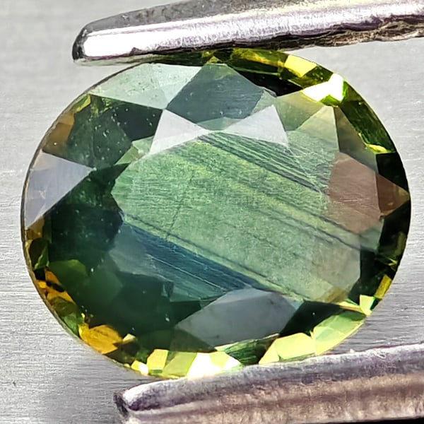 Natural Yellowish Green Sapphire 0.61 Ct. Oval Shape 6 x 5 Mm Gemstones From Thailand: Product ID: 806162418 Product Name: Natural Green Sapphire Weight: 0.61 CT. Size: 6 x 5 x 2.2 MM. Shape: Oval Shape Color: Yellowish Green Clarity:VSI Luster: Good Gems Origin: Thailand Treatment: Hea