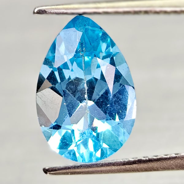 Natural Swiss Blue Topaz 3.32 Ct. Pear Shape 12 x 8.1 Mm Gemstone From Brazil: Product ID: 807168016 Product Name: Natural Blue Topaz Weight: 3.32 CT. Size: 12 x 8.1 x 5.2 MM. Shape: Pear Shape Color: Swiss Blue Clarity:VSI - SI1 Luster: Good Gems Origin: Brazil Treatment: Treat