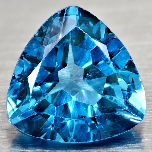 Natural Swiss Blue Topaz 3.37 Ct. Trilliant Shape 9 Mm Gemstone From Brazil: Product ID: 807167946 Product Name: Natural Blue Topaz Weight: 3.37 CT. Size: 9 x 9 x 5.7 MM. Shape: Trilliant Color: Swiss Blue Clarity:VSI Luster: Good Gems Origin: Brazil Treatment: Treated Crystal
