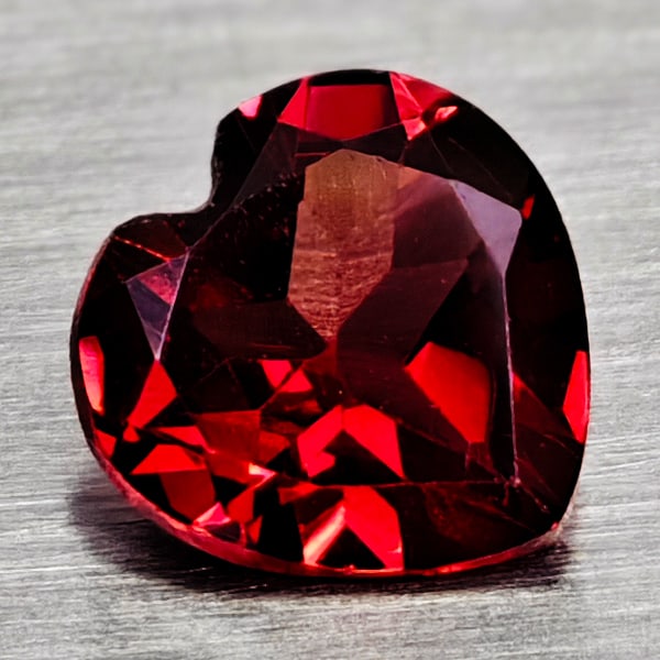 Natural Purplish Red Rhodolite Garnet 0.91 Ct. Heart Shape 6.1 Mm Gemstone From Madagascar: Product ID: 802936659 Product Name: Natural Rhodolite Weight: 0.91 CT. Size: 6.1 x 6.1 x 3.1 MM. Shape: Heart Shape Color: Purplish Red Clarity:VSI Luster: Good Gems Origin: Madagascar Treatment: Unhe