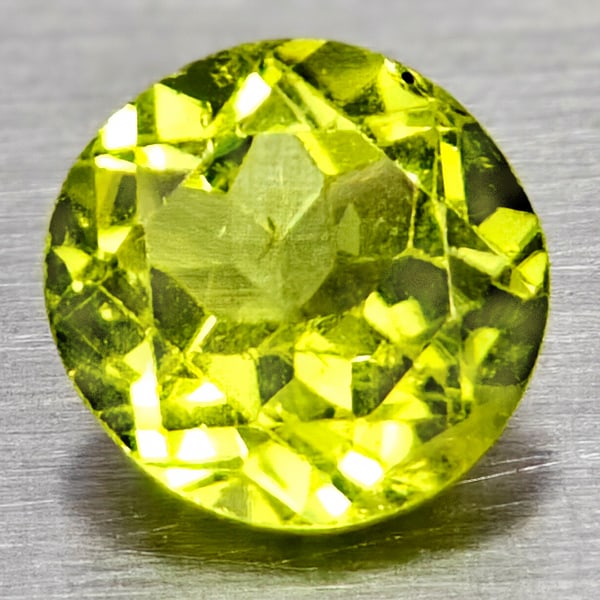 Natural Green Peridot 0.87 Ct. Round Shape 5.8 Mm Gemstone From Pakistan: Product ID: 805317100 Product Name: Natural Peridot Weight: 0.87 CT. Size: 5.8 x 5.8 x 3.6 MM. Shape: Round Color: Green Clarity:VSI Luster: Good Gems Origin: Pakistan Treatment: Unheated Crystal Stru