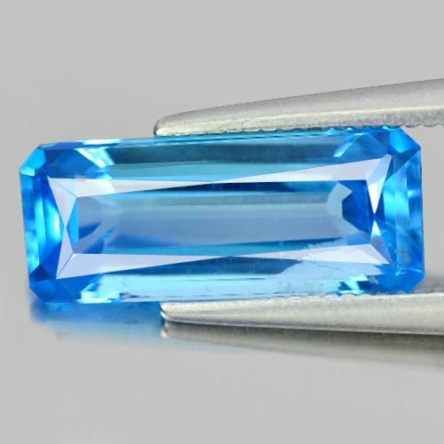 Natural Swiss Blue Topaz 3.46 Ct. Octagon Shape 13.8 x 5.7 Mm. Gemstone From Brazil: Product ID: 807155340 Product Name: Natural Blue Topaz Weight: 3.46 CT. Size: 13.8 x 5.7 x 4.4 MM. Shape: Octagon Color: Swiss Blue Clarity:VSI Luster: Good Gems Origin: Brazil Treatment: Treated Crys