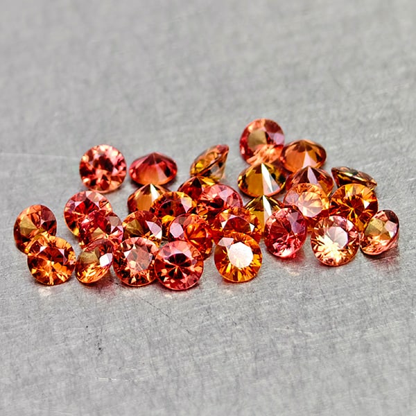 Natural Orange Red Songea Sapphire 1.80 Ct. 29 Pcs Round Diamond Cut 2.4 Mm Gemstones From Tanzania: Product ID: 806162096 Product Name: Natural Orange Sapphire Weight: 1.80 CT. Size: 2.4 x 2.4 x 1.5 MM. Shape: Round Diamond Cut Color: Orange Red Clarity:VSI Luster: Very Good Gems Origin: Tanzania Tr