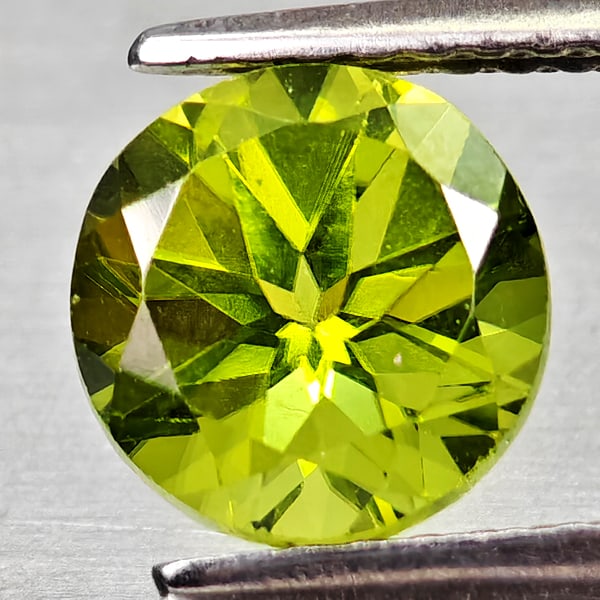 Natural Green Peridot 1.85 Ct. Round Shape 7.2 Mm Gemstone From Pakistan: Product ID: 805317201 Product Name: Natural Peridot Weight: 1.85 CT. Size: 7.2 x 7.2 x 5.5 MM. Shape: Round Color: Green Clarity:VSI Luster: Good Gems Origin: Pakistan Treatment: Unheated Crystal Stru