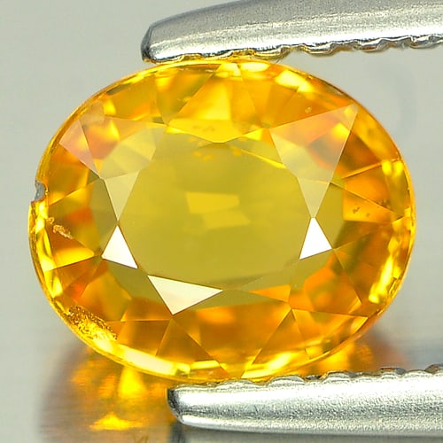 Natural Orangish Yellow Sapphire 1.04 Ct. Oval Shape 6.4 x 5.4 Mm. Gemstone From Thailand: Product ID: 806139935 Product Name: Natural Yellow Sapphire Weight: 1.04 CT. Size: 6.4 x 5.4 x 3 MM. Shape: Oval Color: Orangish Yellow Clarity:SI Luster: Good Gems Origin: Thailand Treatment: Heated 