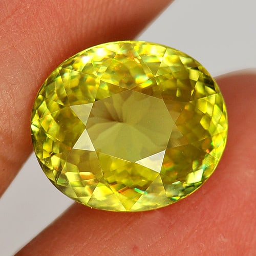 Natural Multi Color Titanium Sphene Rainbow Spark 6.53 Ct. Oval Shape 12.7 x 11 Mm. Unheated: Product ID: 806507460 Product Name: Natural Sphene Weight: 6.53 CT. Size: 12.7 x 11 x 6.1 MM. Shape: Oval Color: Multi Color With Rainbow Spark Clarity:VVS Luster: Adamantine Gems Origin: Madagascar T
