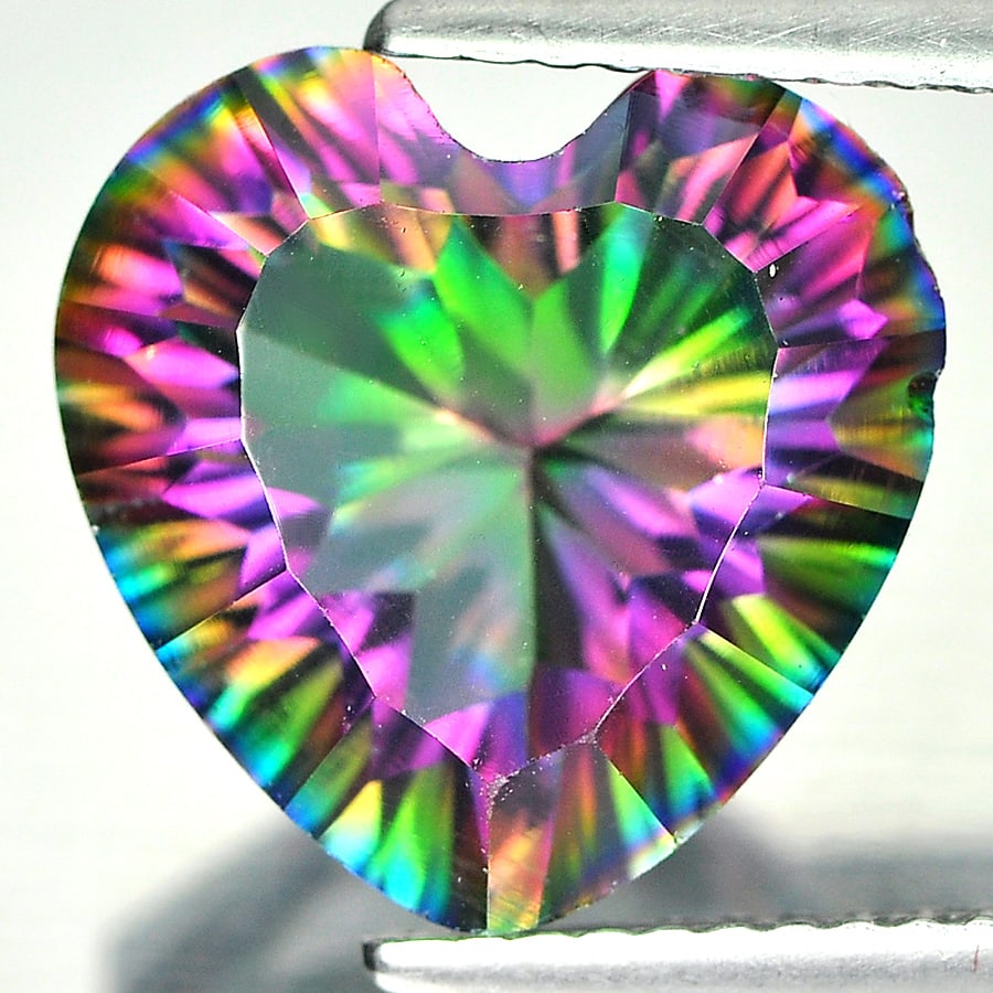 Mystic Green Natural Quartz 4.88 Ct. Heart Concave Cut 12.1 x 11.9 Mm. Gemstone From Brazil: Product ID: 805525350 Product Name: Natural Quartz Weight: 4.88 CT. Size: 12.1 x 11.9 x 6.9 MM. Shape: Heart Concace Cut Color: Mystic Clarity:SI1 Luster: Good Gems Origin: Brazil Treatment: Treated C