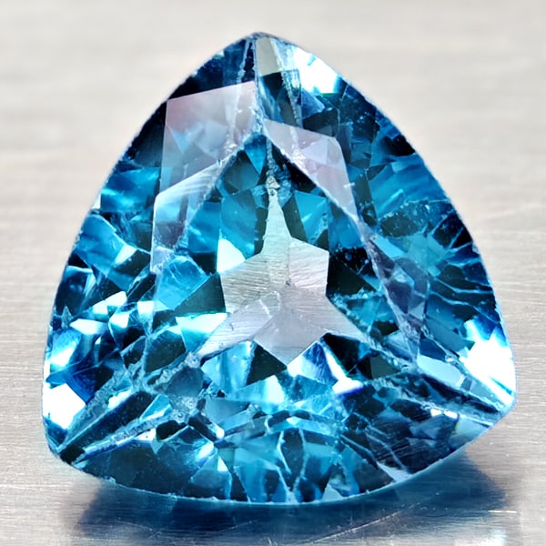 Natural Swiss Blue Topaz 4.31 Ct. Trilliant Shape 10 Mm Gemstone From Brazil: Product ID: 807167939 Product Name: Natural Blue Topaz Weight: 4.31 CT. Size: 10 x 10 x 6.1 MM. Shape: Trilliant Color: Swiss Blue Clarity:VSI Luster: Good Gems Origin: Brazil Treatment: Treated Cryst