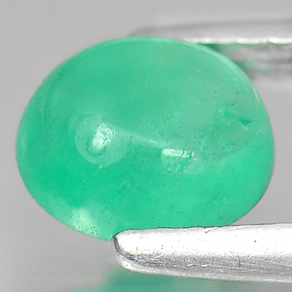 Natural Green Emerald 0.93 Ct. Oval Cabochon Shape 6.7 x 5.7 Mm. Unheated Gemstone From Columbia: Product ID: 802402469 Product Name: Natural Emerald Weight: 0.93 CT. Size: 6.7 x 5.7 x 3.3 MM. Shape: Oval Cabochon Color: Green Clarity:Semi - Transparent Luster: Good Gems Origin: Columbia Treatment