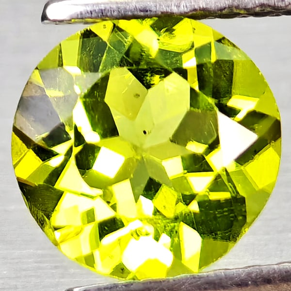 Natural Green Peridot 1.25 Ct. Round Shape 7 Mm Gemstone From Pakistan: Product ID: 805317208 Product Name: Natural Peridot Weight: 1.25 CT. Size: 7 x 7 x 3.9 MM. Shape: Round Color: Green Clarity:VSI Luster: Good Gems Origin: Pakistan Treatment: Unheated Crystal Structur