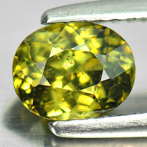 Natural Green Demantoid Garnet 1.24 Ct. Oval Shape 6.67 x 5.40 Mm. Unheated Gemstone From Madagascar: Product ID: 802921196 Product Name: Natural Demantoid Weight: 1.24 CT. Size: x 4.04 MM. Shape: Oval Color: Green Clarity:SI1 Luster: Very Good Gems Origin: Mardagascar Treatment: Unheated Crystal Stru