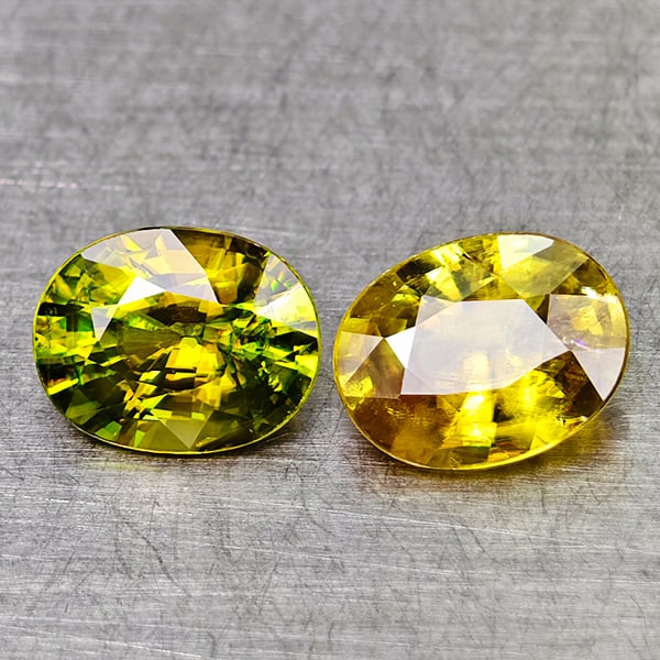 Natural Green Titanium Sphene With Rainbow Spark 1.55 Ct. 2 Pcs Oval Shape 6.5 x 5 Mm Gemstone: Product ID: 806509045 Product Name: Natural Sphene Weight: 1.55 CT. Size: 6.5 x 5 x 3 MM. Shape: Oval Color: Yellow Green With Rainbow Spark Clarity:SI1 Luster: Good Gems Origin: Madagascar Treatment: