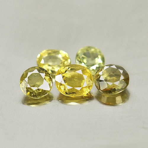 Natural Yellow Sapphire 1.45 Ct. Mix Shape 5 Pcs. Gemstone From Thailand: Product ID: 806152123 Product Name: Natural Yellow Sapphire Weight: 1.45 CT. Size: 4.5 x 3.8 x 2.5 MM. Shape: Mix Shape Color: Yellow Clarity:SI1 Luster: Good Gems Origin: Thailand Treatment: Heated C