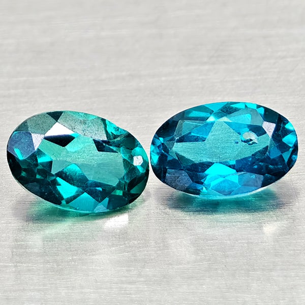 Natural Bluish Green Topaz 1.20 Ct. 2 Pcs Oval Shape 6.3 x 4.3 Mm Gemstones from Brazil: Product ID: 807168079 Product Name: Natural Topaz Weight: 1.20 CT. Size: 6.3 x 4.3 x 3 MM. Shape: Oval Color: Bluish Green Clarity:VSI Luster: Good Gems Origin: Brazil Treatment: Treated Crystal Struc