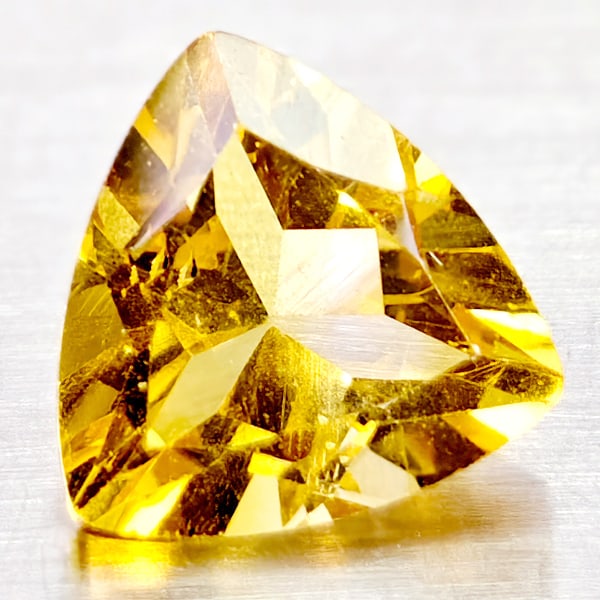Natural Yellow Citrine 1.15 Ct. Trilliant Shape 7.1 Mm Unheated Gemstone From Brazil: Product ID: 801815066 Product Name: Natural Citrine Weight: 1.15 CT. Size: 7.1 x 7.1 x 4.7 MM. Shape: Trilliant Color: Yellow Clarity:IF Luster: Good Gems Origin: Brazil Treatment: Unheated Crystal St