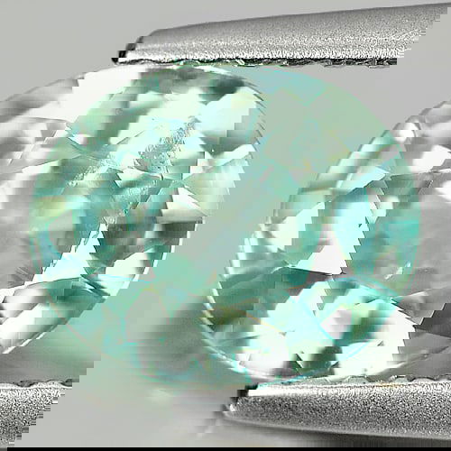 Natural Blue Zircon 1.71 Ct. Oval Shape 7.8 x 6.5 Mm Gemstone from Cambodia: Product ID: 807720806 Product Name: Natural Zircon Weight: 1.71 CT. Size: 7.8 x 6.5 x 3.6 MM. Shape: Oval Color: Blue Clarity:SI Luster: Good Gems Origin: Cambodia Treatment: Heated Crystal Structure: