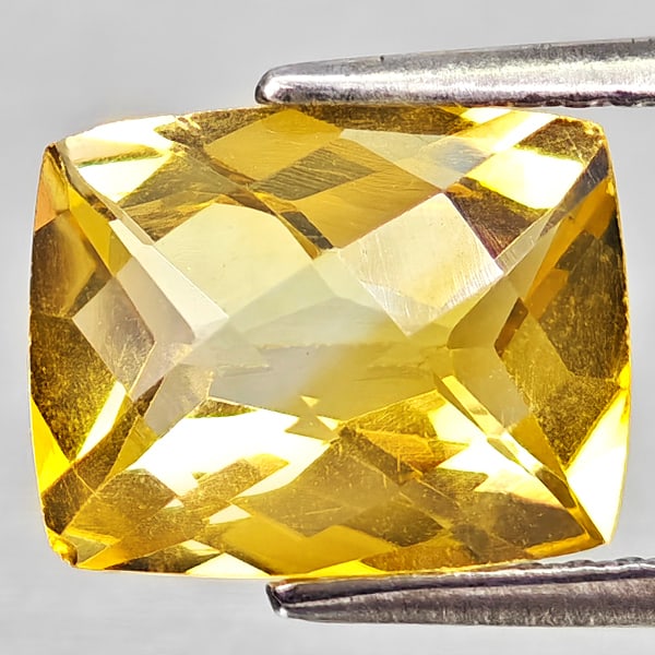 Natural Yellow Citrine 2.61 Ct. Cushion Checkerboard Cut 10.1 x 7.9 Mm Gemstone From Brazil: Product ID: 801815235 Product Name: Natural Citrine Weight: 2.61 CT. Size: 10.1 x 7.9 x 5.1 MM. Shape: Cushion Checkerboard Cut Color: Yellow Clarity:VVS - VSI Luster: Good Gems Origin: Brazil Treatme