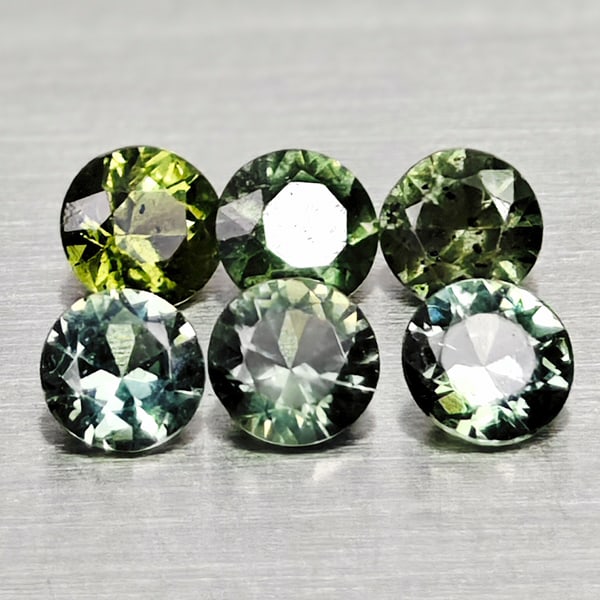 Natural Green Sapphire 0.43 Ct. 6 Pcs. Round Diamond Cut 2.5 Mm. Gemstones From Thailand: Product ID: 806162488 Product Name: Natural Green Sapphire Weight: 0.43 CT. Size: 2.5 x 2.5 x 1.6 MM. Shape: Round Diamond Cut Color: Green Clarity:VSI Luster: Good Gems Origin: Thailand Treatment: He