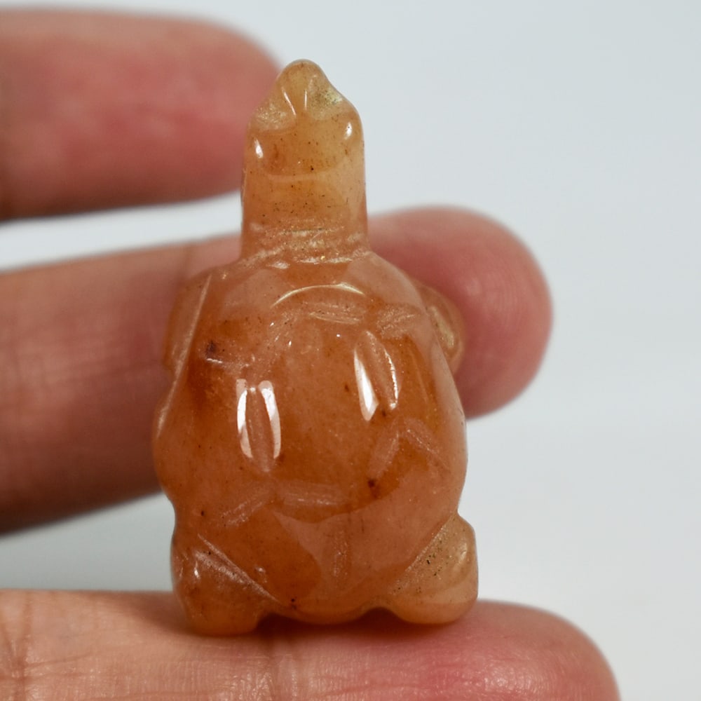 Natural Honey Jade 76.52 Ct. Turtle Carving Size 22 x 35 x 16 Mm. Gemstone: Product ID: 818102497 Product Name: Natural Gemstones Weight: 76.52 CT. Size: 22 x 35 x 16 MM. Shape: Caving Color: brown Honey Clarity:Opaque Luster: Good Gems Origin: Burma Treatment: Unheated Cryst