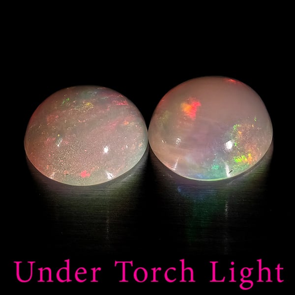 Natural Multi Color Opal 1.51 Ct. 2 Pcs Round Cabochon Shape 7 Mm Gemstones From Ethiopia: Product ID: 818728188 Product Name: Natural Opal Weight: 1.51 CT. Size: 7 x 7 x 3.4 MM. Shape: Round Cabochon Color: Multi-Color Clarity:Semi - Transparent Luster: Good Gems Origin: Ethiopia Treatment