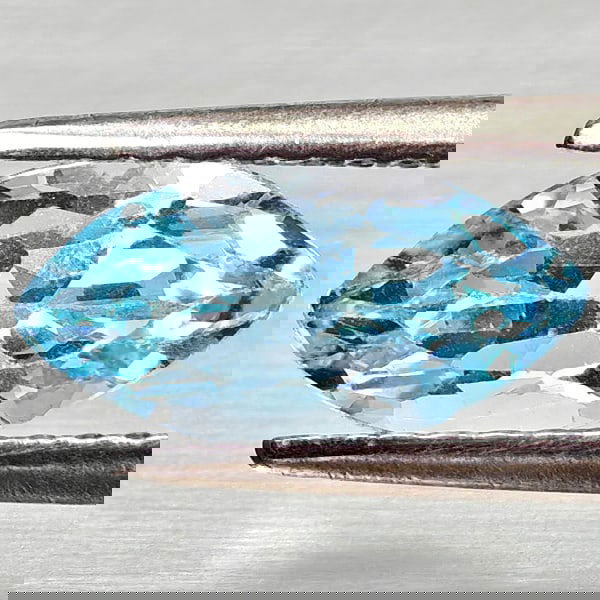 Natural Swiss Blue Topaz 1.66 Ct. Marquise Shape 10.2 x 5.2 Mm Gemstone From Brazil: Product ID: 807168193 Product Name: Natural Blue Topaz Weight: 1.66 CT. Size: 10.2 x 5.2 x 4.6 MM. Shape: Marquise Shape Color: Swiss Blue Clarity:VSI Luster: Good Gems Origin: Brazil Treatment: Treat