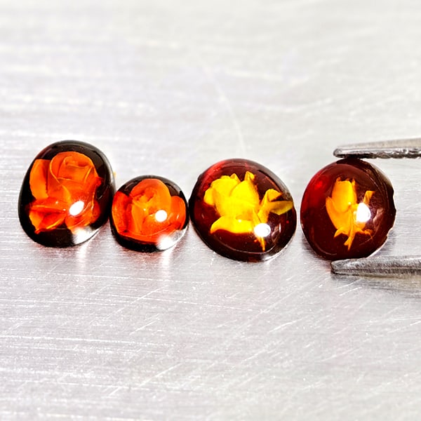 Natural Amber 1.18 Ct. 4 Pcs Flower Carving In Mixed Shape Cabochon Gemstones From Poland: Product ID: 819091050 Product Name: Natural Amber Weight: 1.18 CT. Size: 7.4 x 6 x 3.1 to 5.1 x 5.1 x 2.9 MM. Shape: Mixed Shape Cabochon Color: Brown Yellow Clarity:Semi - Transparent Luster: Good Ge
