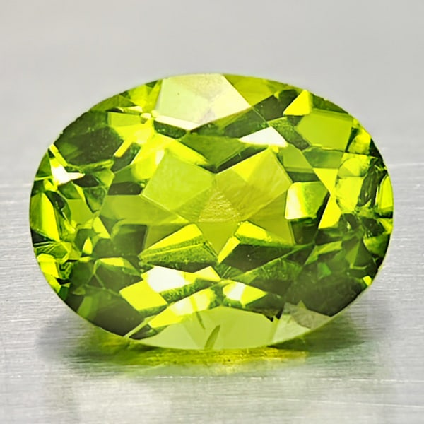 Natural Green Peridot 2.25 Ct. Oval Shape 6.7 x 9.2 Mm. Gemstone From Pakistan: Product ID: 805316939 Product Name: Natural Peridot Weight: 2.25 CT. Size: 6.7 x 9.2 x 5.2 MM. Shape: Oval Color: Green Clarity:VSI Luster: Good Gems Origin: Pakistan Treatment: Unheated Crystal Struc