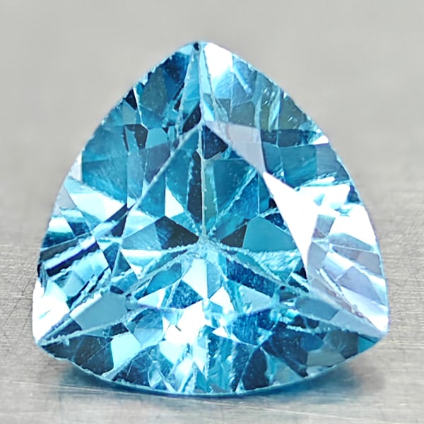 Natural Swiss Blue Topaz 2.74 Ct. Trilliant Shape 9.1 Mm Gemstone From Brazil: Product ID: 807167868 Product Name: Natural Blue Topaz Weight: 2.74 CT. Size: 9.1 x 9.1 x 5.5 MM. Shape: Trilliant Color: Swiss Blue Clarity:VSI Luster: Good Gems Origin: Brazil Treatment: Treated Cry