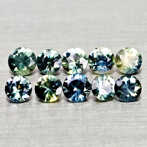 Natural Fancy Color Sapphire 0.97 Ct. 10 Pcs Round Diamand Cut 2.9 to 1.8 Mm Gemstones From Tanzania: Product ID: 806162189 Product Name: Natural Green Sapphire Weight: 0.97 CT. Size: 2.9 x 2.9 x 1.9 to 2.6 x 2.6 x 1.8 MM. Shape: Round Diamond Cut Color: Fancy Color Clarity:VSI Luster: Very Good Gems 