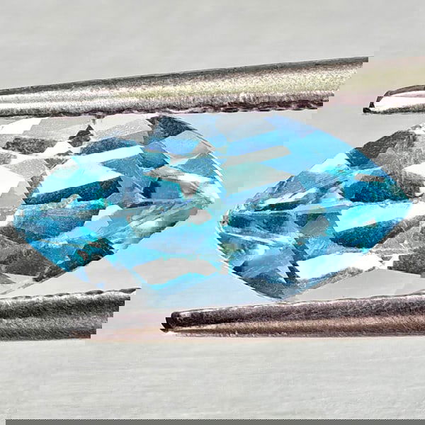 Natural Swiss Blue Topaz 1.49 Ct. Marquise Shape 10.2 x 4.3 Mm Gemstone From Brazil: Product ID: 807168192 Product Name: Natural Blue Topaz Weight: 1.49 CT. Size: 10.2 x 4.3 x 5.3 MM. Shape: Marquise Shape Color: Swiss Blue Clarity:VSI Luster: Good Gems Origin: Brazil Treatment: Treat