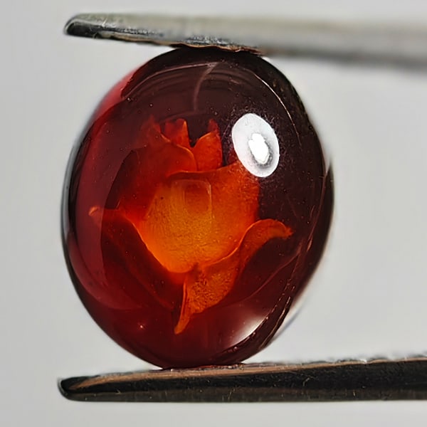 Natural Amber 0.56 Ct. Flower Carving In Oval Cabochon Shape 8.8 x 7.4 Mm Gemstone From Poland: Product ID: 819090975 Product Name: Natural Amber Weight: 0.56 CT. Size: 8.8 x 7.4 x 3.3 MM. Shape: Oval Cabochon Color: Brown Yellow Clarity:Semi - Transparent Luster: Good Gems Origin: Poland Treatm