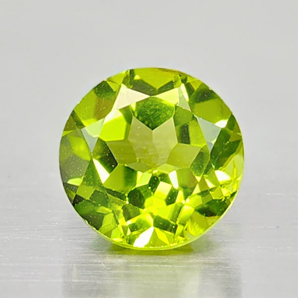 Natural Green Peridot 2.53 Ct. Round Shape 8 Mm. Gemstone From Thailand: Product ID: 805316921 Product Name: Natural Peridot Weight: 2.53 CT. Size: 8 x 8 x 5.7 MM. Shape: Round Color: Green Clarity:VSI Luster: Good Gems Origin: Thailand Treatment: Unheated Crystal Structur