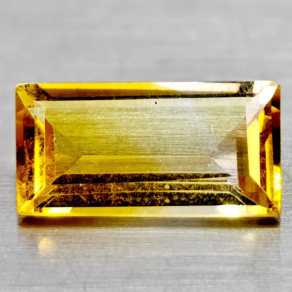 Natural Yellow Citrine 1.24 Ct. Clean Baguette Shape 10 x 5.2 Mm Gemstone From Brazil: Product ID: 801815044 Product Name: Natural Citrine Weight: 1.24 CT. Size: 10 x 5.2 x 3.1 MM. Shape: Baguette Color: Yellow Clarity:If Luster: Good Gems Origin: Brazil Treatment: Unheated Crystal Stru