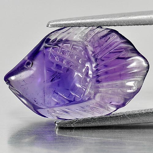 Natural Violet Amethyst 5.84 Ct. Fish Carving Size 19.4 x 12.7 Mm Gemstone From Brazil: Product ID: 810302715 Product Name: Natural Amethyst Weight: 5.84 CT. Size: 19.4 x 12.7 x 4.9 MM. Shape: Fish Carving Color: Violet Clarity:Semi - Transparent Luster: Good Gems Origin: Brazil Treatmen