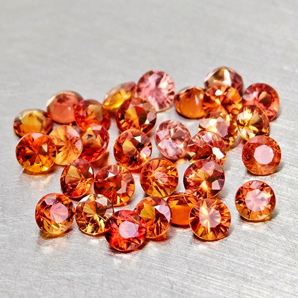Natural Orange Red Songea Sapphire 2.36 Ct. 30 Pcs Round Diamond Cut 2.5 Mm Gemstones From Tanzania: Product ID: 806162046 Product Name: Natural Red Sapphire Weight: 2.48 CT. Size: 2.5 x 2.5 x 1.5 MM. Shape: Round Diamond Cut Color: Red Orange Clarity:VSI Luster: Good Gems Origin: Tanzania Treatment:
