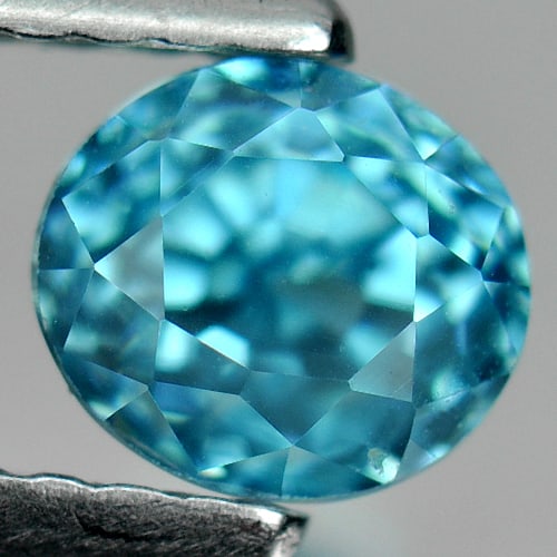 Natural Blue Zircon 1.41 Ct. Clean Oval Shape 5.4 x 4.8 Mm Gemstone From Cambodia: Product ID: 807712170 Product Name: Natural Zircon Weight: 1.41 CT. Size: 5.4 x 4.8 x 5 MM. Shape: Oval Color: Blue Clarity:IF Luster: Good Gems Origin: Cambodia Treatment: Heated Crystal Structure: T