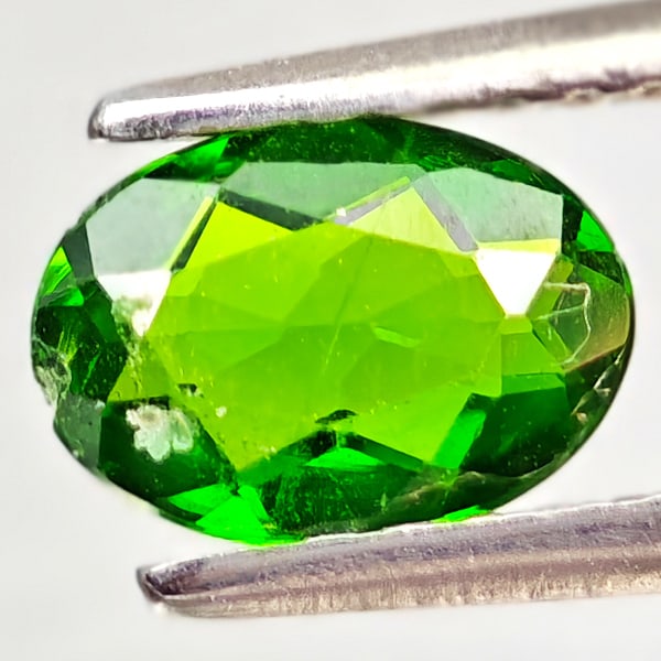 Natural Green Chrome Diopside 0.71 Ct. Oval Shape 7 x 5 Mm Gemstone From Russia: Product ID: 801608136 Product Name: Natural Chrome Diopside Weight: 0.71 CT. Size: 7 x 5 x 2.7 MM. Shape: Oval Color: Green Clarity:VSI - SI1 Luster: Good Gems Origin: Russia Treatment: Unheated Cryst