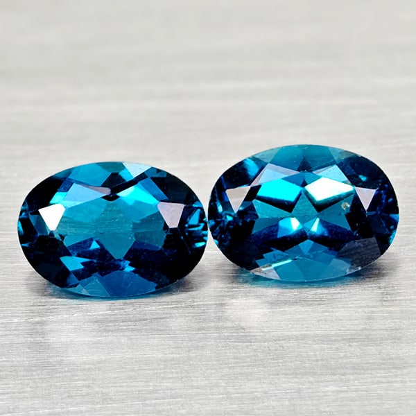 Natural London Blue Topaz 1.91 Ct. 2 Pcs Oval Shape 7 x 5 Mm Gemstones From Brazil: Product ID: 807168062 Product Name: Natural Blue Topaz Weight: 1.91 CT. Size: 7 x 5 x 3.1 MM. Shape: Oval Color: London Blue Clarity:VSI Luster: Good Gems Origin: Brazil Treatment: Treated Crystal Str