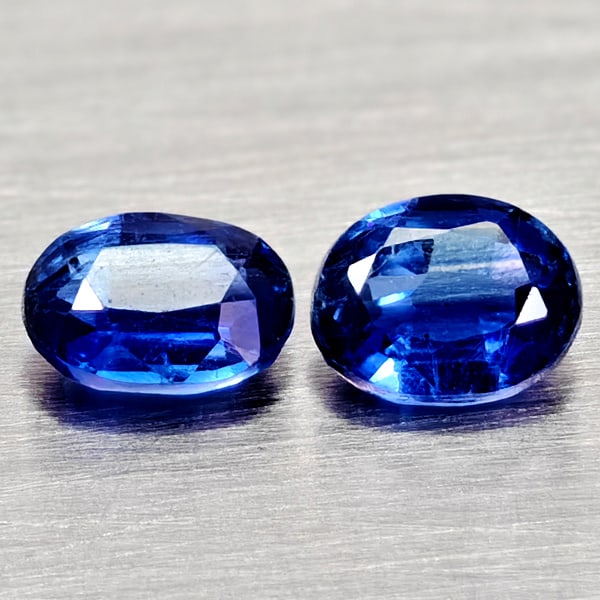 Natural Blue Kyanite 0.97 Ct. 2 Pcs. Oval Shape Gemstones From Sri - Lanka: Product ID: 804204821 Product Name: Natural Kyanite Weight: 0.97 CT. Size: 5.2 x 4.2 x 2.5 to 5.2 x 4 x 2.4 MM. Shape: Oval Color: Blue Clarity:VSI - SI1 Luster: Good Gems Origin: Sri - Lanka Treatmen