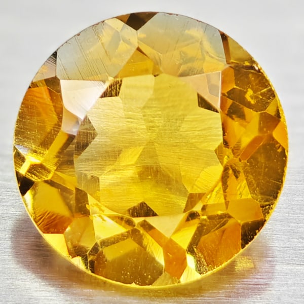Natural Yellow Citrine 1.29 Ct. VVS Round Shape 7 Mm. Gemstone From Brazil: Product ID: 801813580 Product Name: Natural Citrine Weight: 1.29 CT. Size: 7 x 7 x 4.9 MM. Shape: Round Color: yellow Clarity:VVS Luster: Good Gems Origin: Barzil Treatment: Unheated Crystal Structure