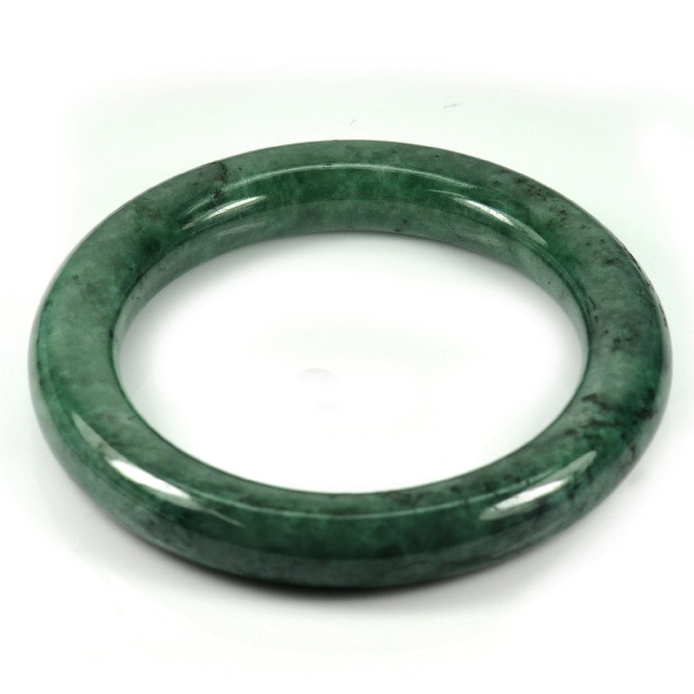 Natural Green Jade Bangle 274.90 Ct. Diameter 52 Mm. Unheated Gemstone: Product ID: 819815128 Product Name: Natural Jade Weight: 274.90 CT. Size: 72 x 52 x 10 MM. Shape: Round Cabochon Color: Green Clarity:Opaque Luster: Good Gems Origin: Thailand Treatment: Unheated Crys